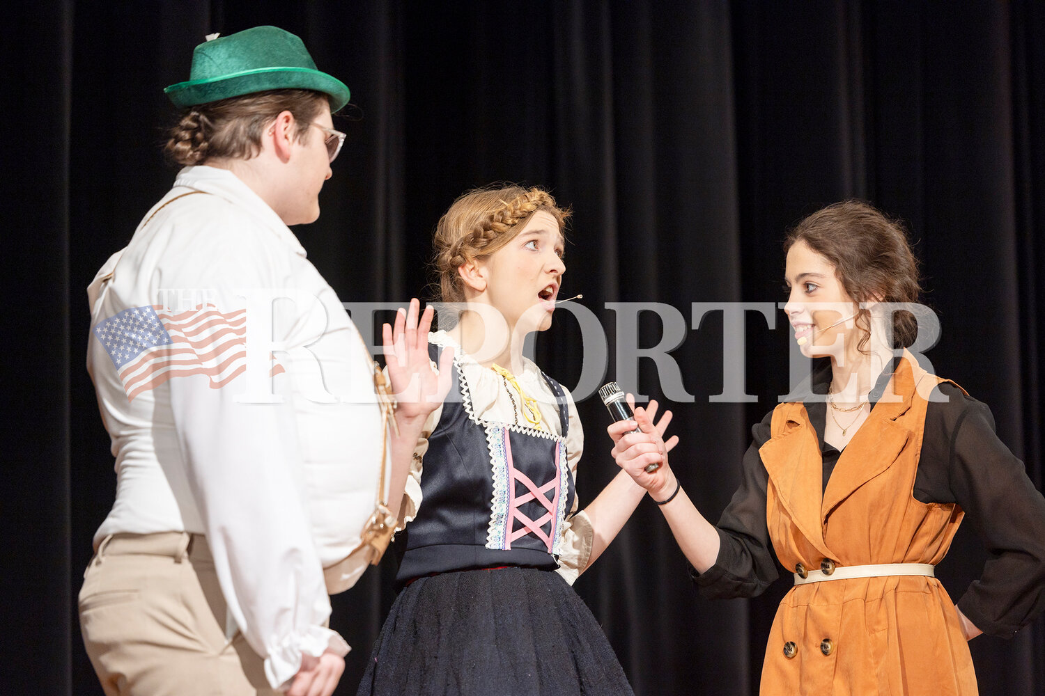 From left, Augustus Gloop played by Jacob Morse, Mrs. Gloop played by Kahrin Vesterfelt, and Penelope Trout played by Leila Pedro, perform Saturday, March 23.